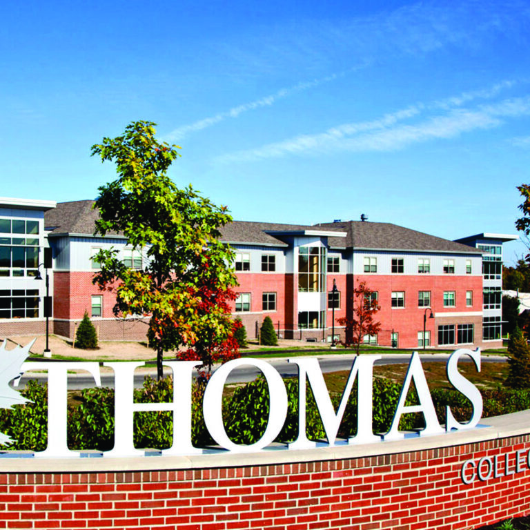 Construction management services with Thomas Collage featured.