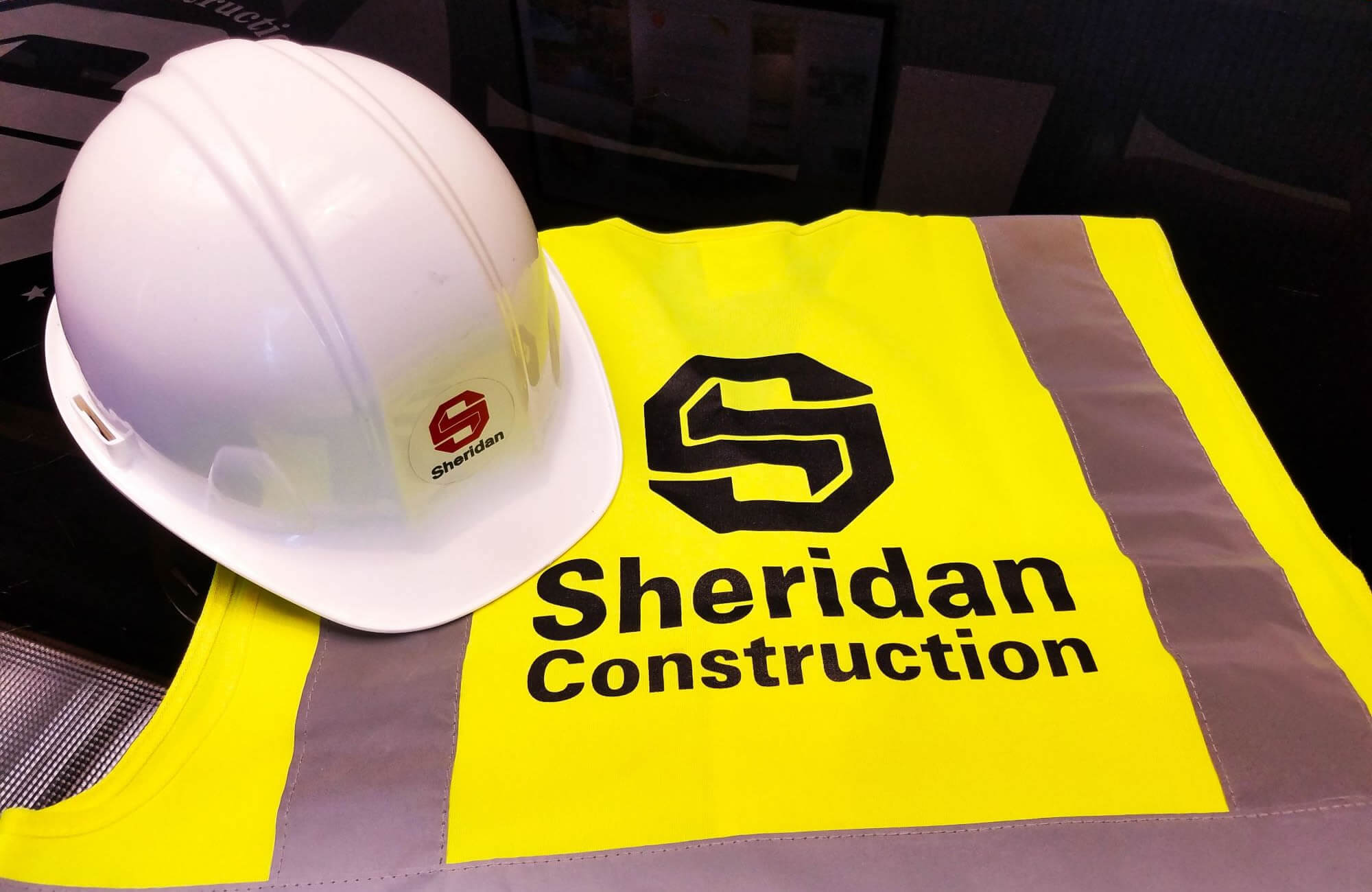 Sheridan Construction safety vest and hard hat.