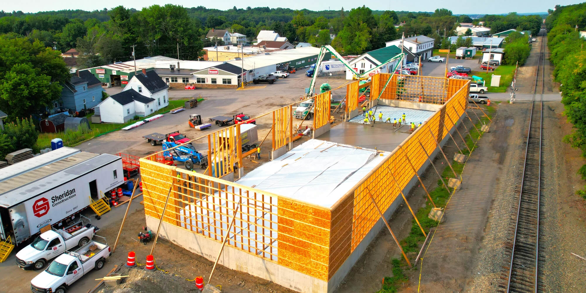 Wood frame building with concrete floor in progress.