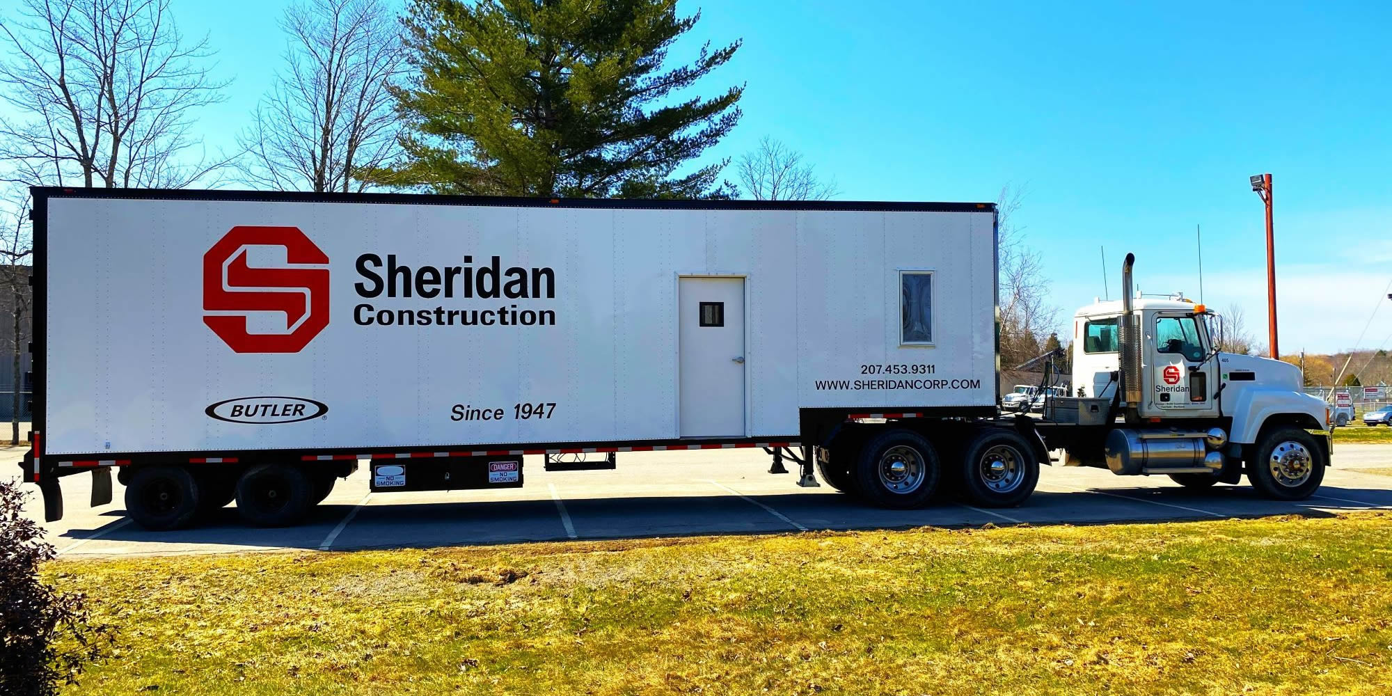 One of Sheridan Construction's tractor trailer about to leave to go to a job site.