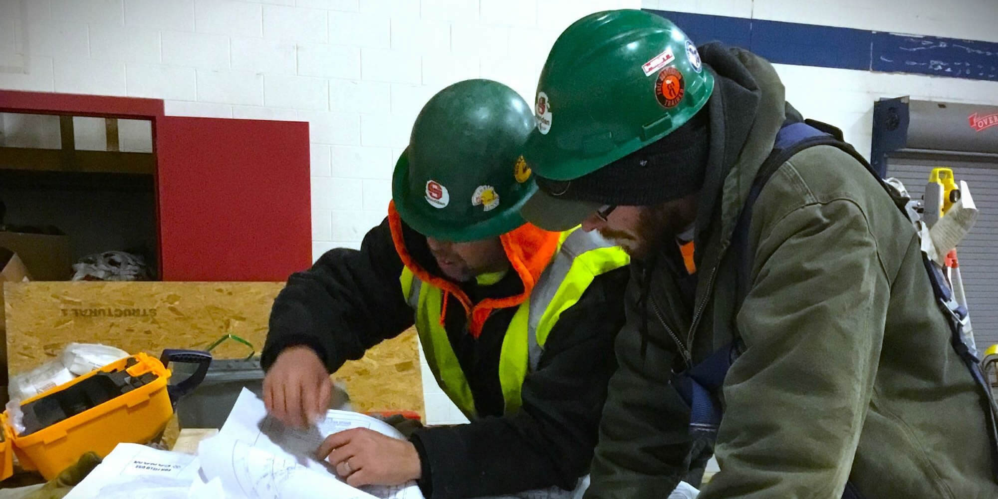 Construction team members reviewing an engineering design.