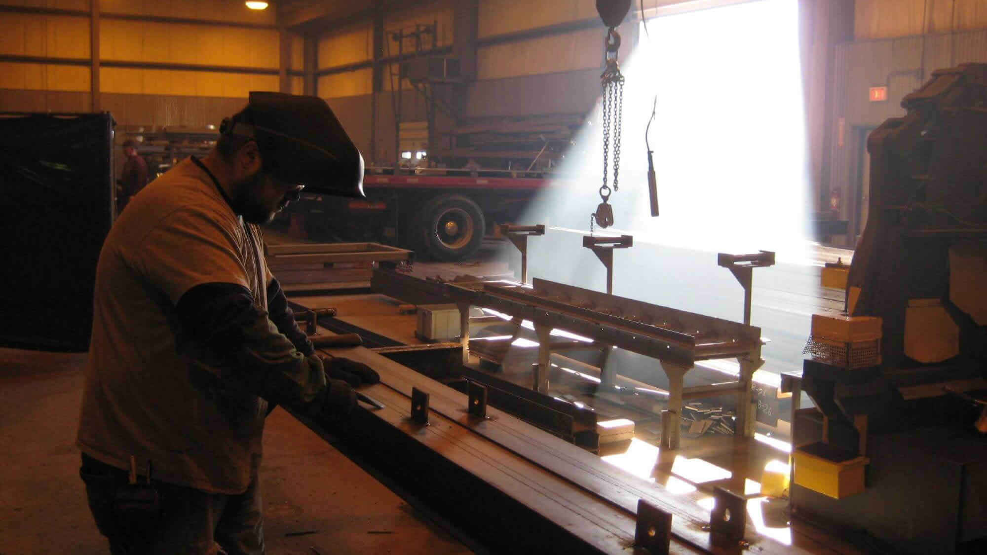 Sheridan team member fabricating steel.