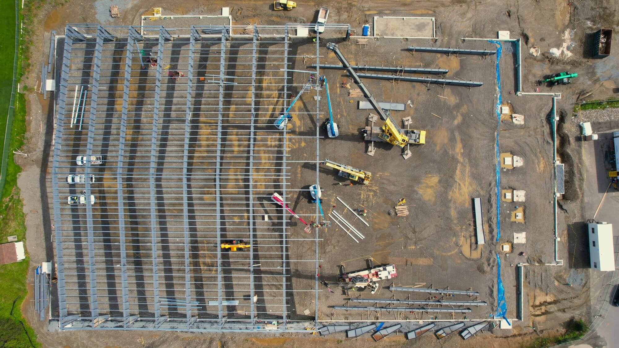 Pre-fabricated steel building, image shows structure in progress.